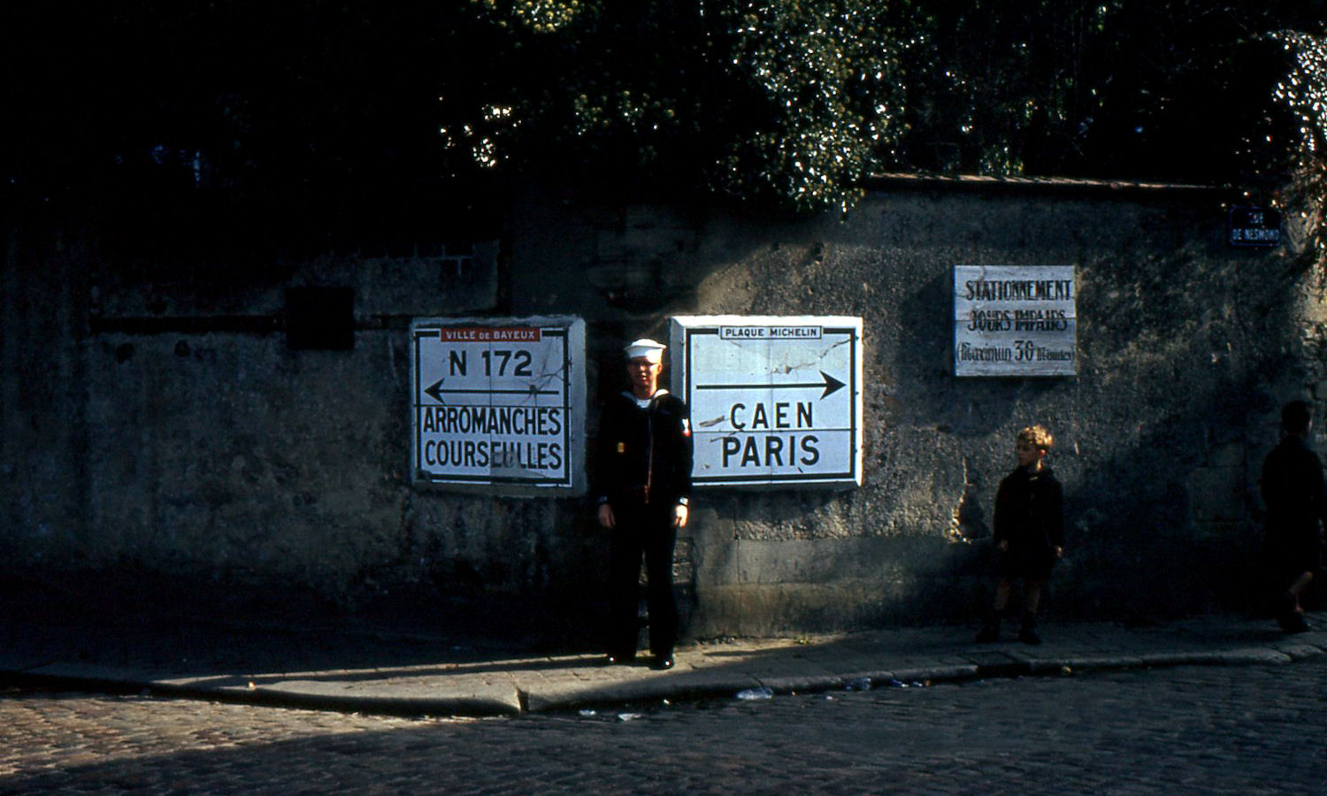 Harold Simson EMFn (54-57) with road signs - Normandy France